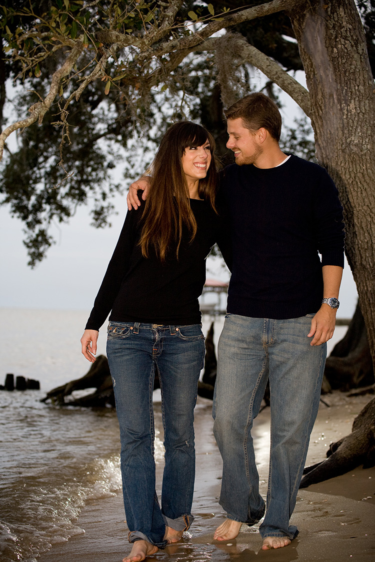 A couple walks on the beach on the Northshore of Lake Pontchartrain. | Photo by Jessica the Photographer