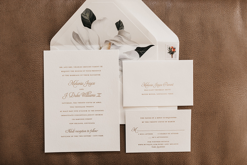 The invitation suite featuring a Magnolia motif.