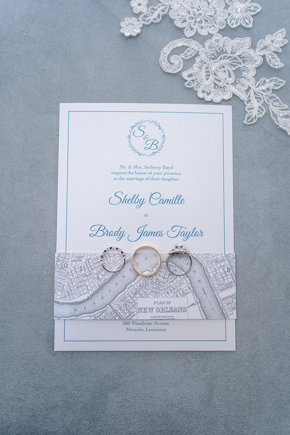 The wedding rings on the wedding invitations.