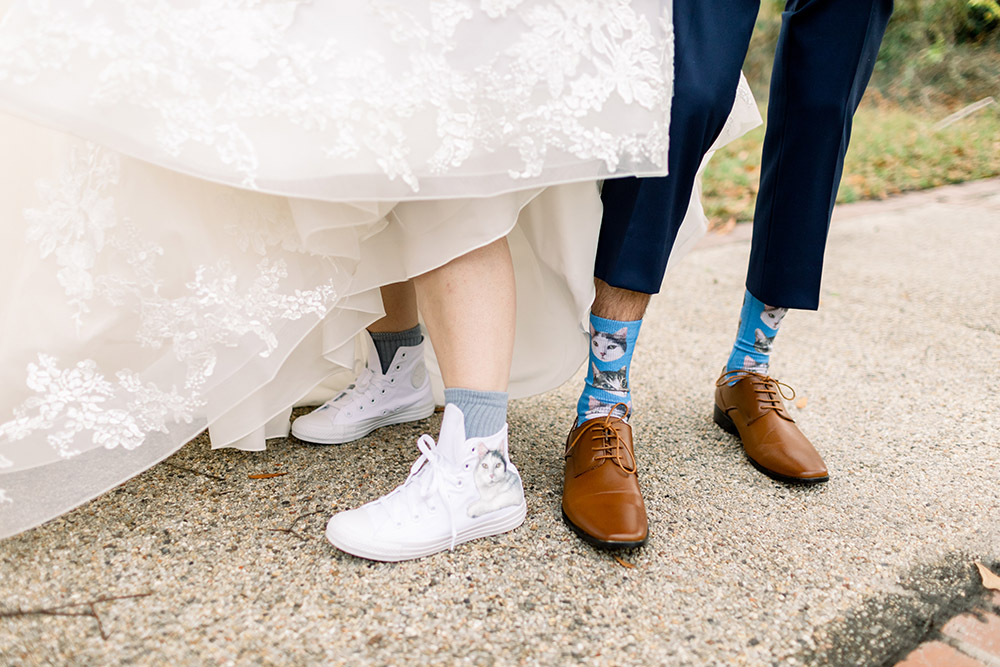 Gracie and Ross included their cats in their wedding with special shoe and sock details.