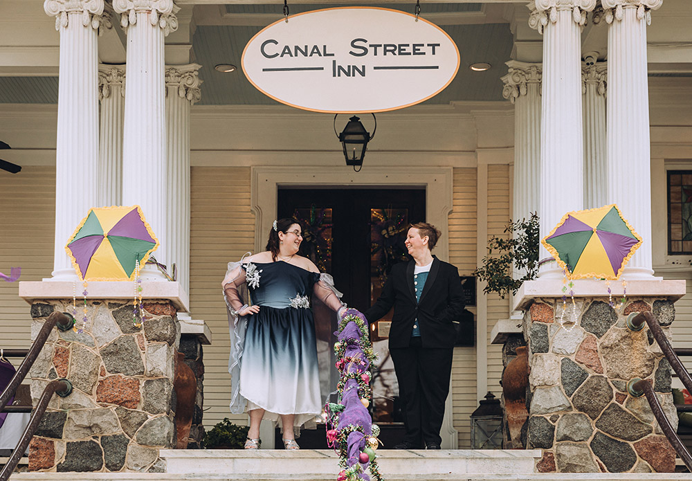 the brides on the porch of Canal Street Inn in New Orleans