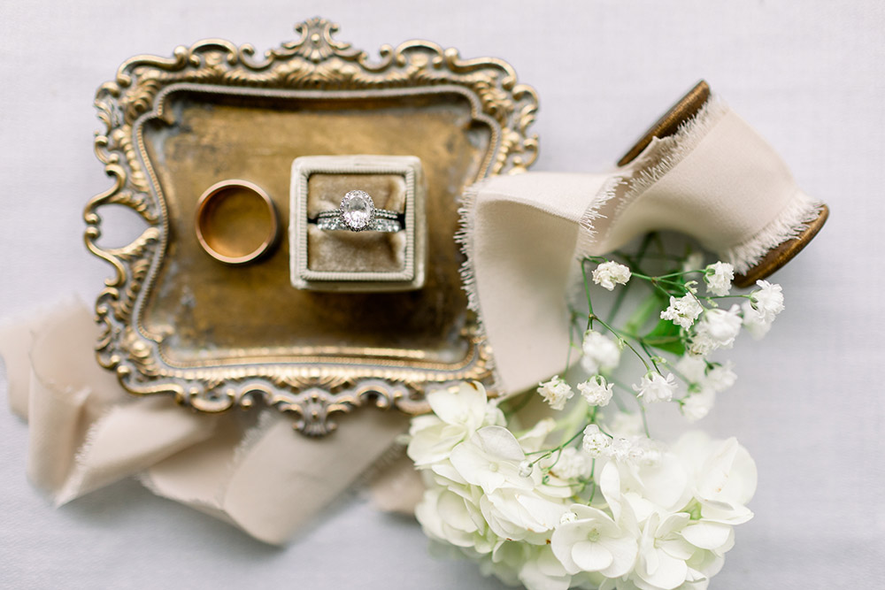 wedding rings on a gold tray