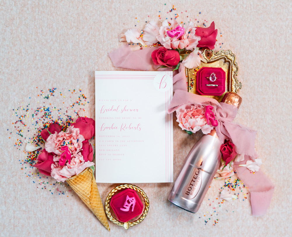 Pink bridal shower invitation flatlay
