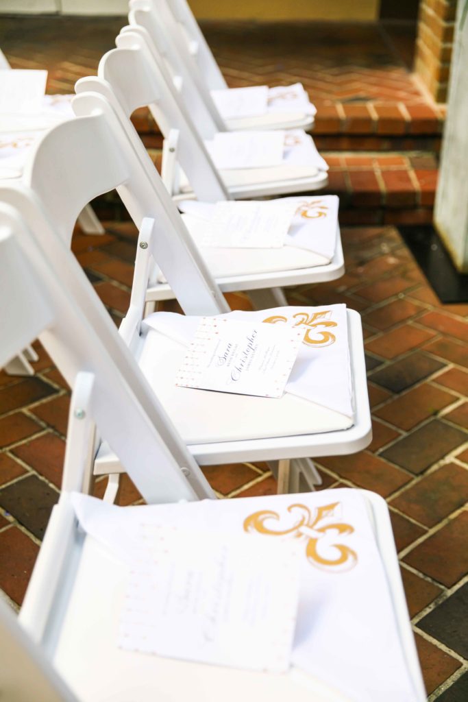Programs and second line handkerchiefs on guest chairs.