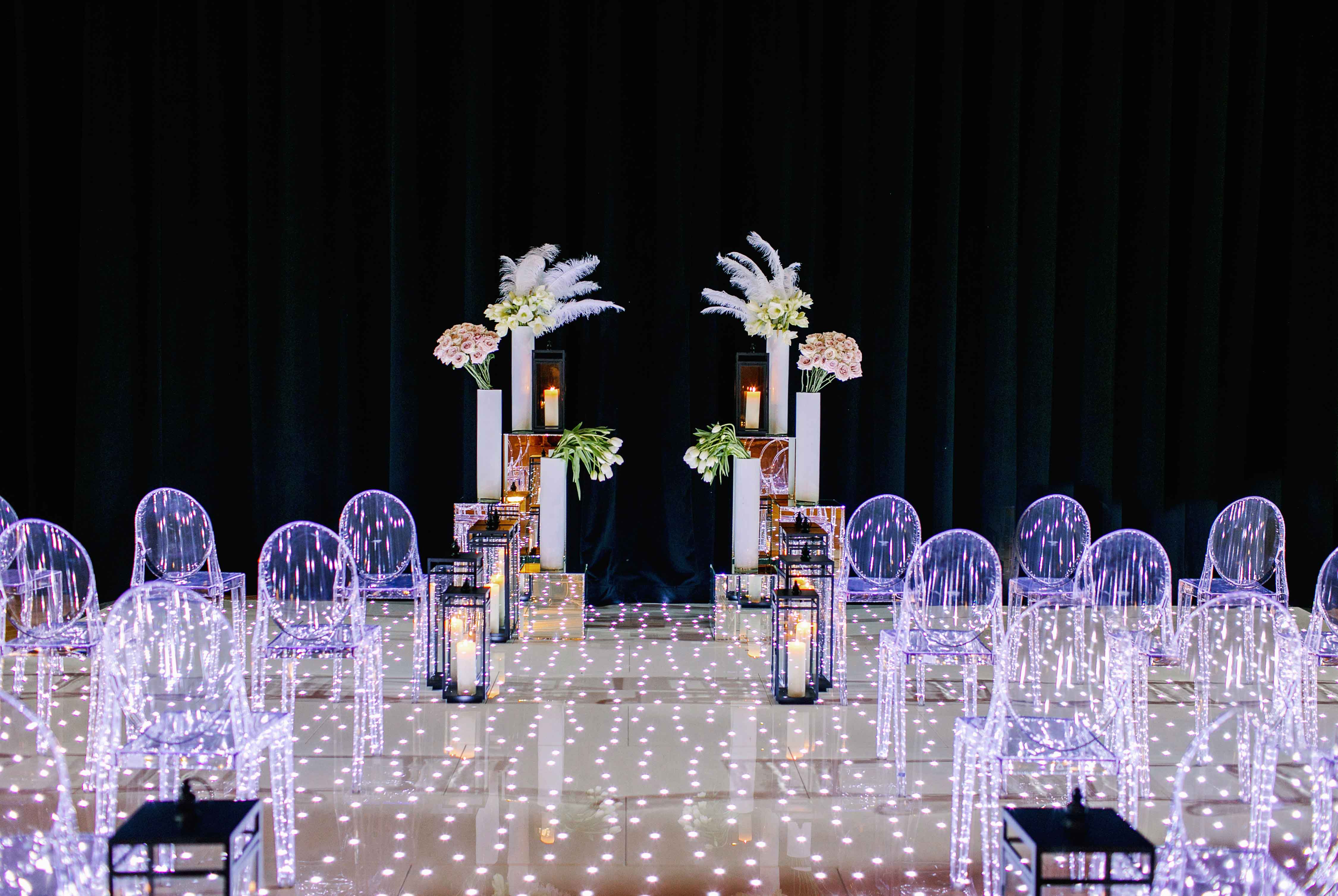 True Value Rental's LED dance floor and ghost chairs set for a wedding ceremony. Photo by Theresa Elizabeth Photography