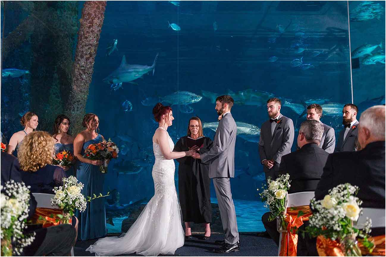 Wedding ceremony at The Aquarium of the Americas. Photo: Studio Tran.