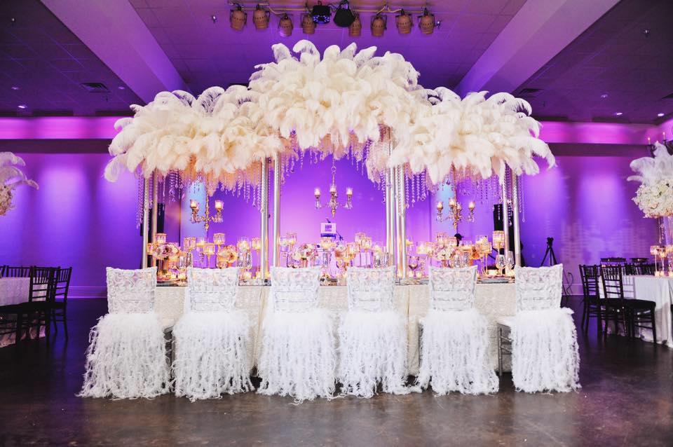 A luxurious white feather decorated reception table at The Cannery. Photo: Studio Tran
