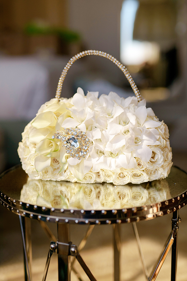 Doliecha's bridesmaid carried a stunning floral "purse" created by Bella Blooms.