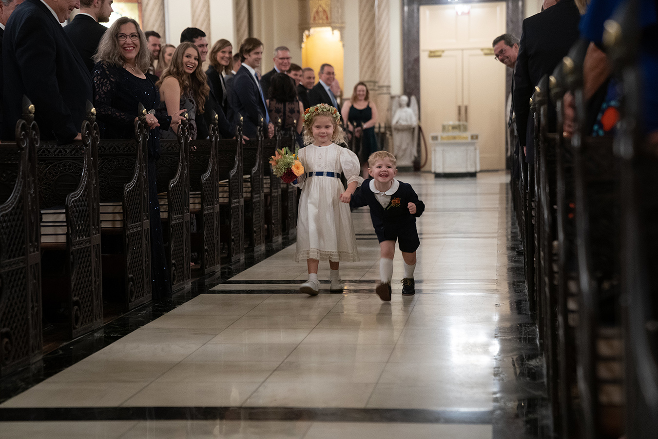 The couples didn't have a ring "bear"er, but a ring "dinosaur" according to Margaret's 3-year-old nephew George, who stomped up the aisle like a dinosaur with the flower girl, Margaret’s niece, Caroline.