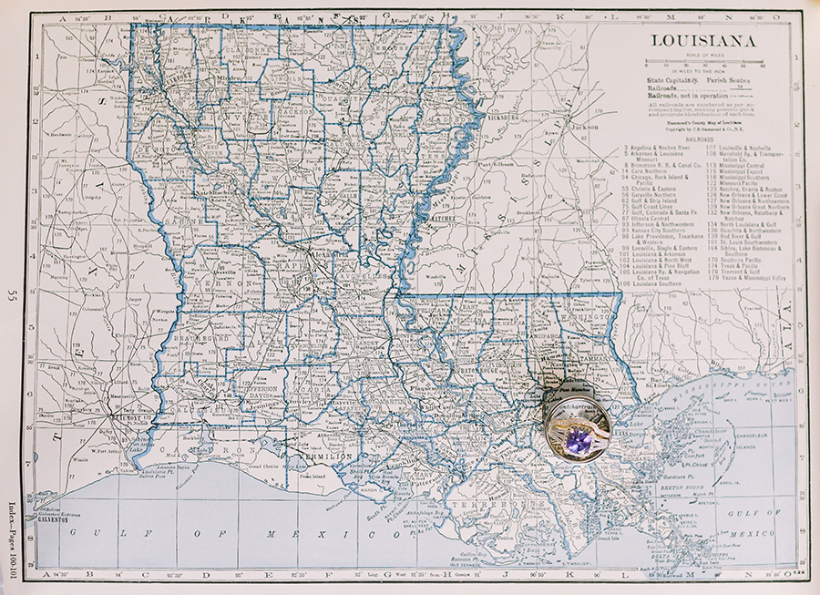 Wedding rings on an antique map of Louisiana by Sarah Alleman Photography