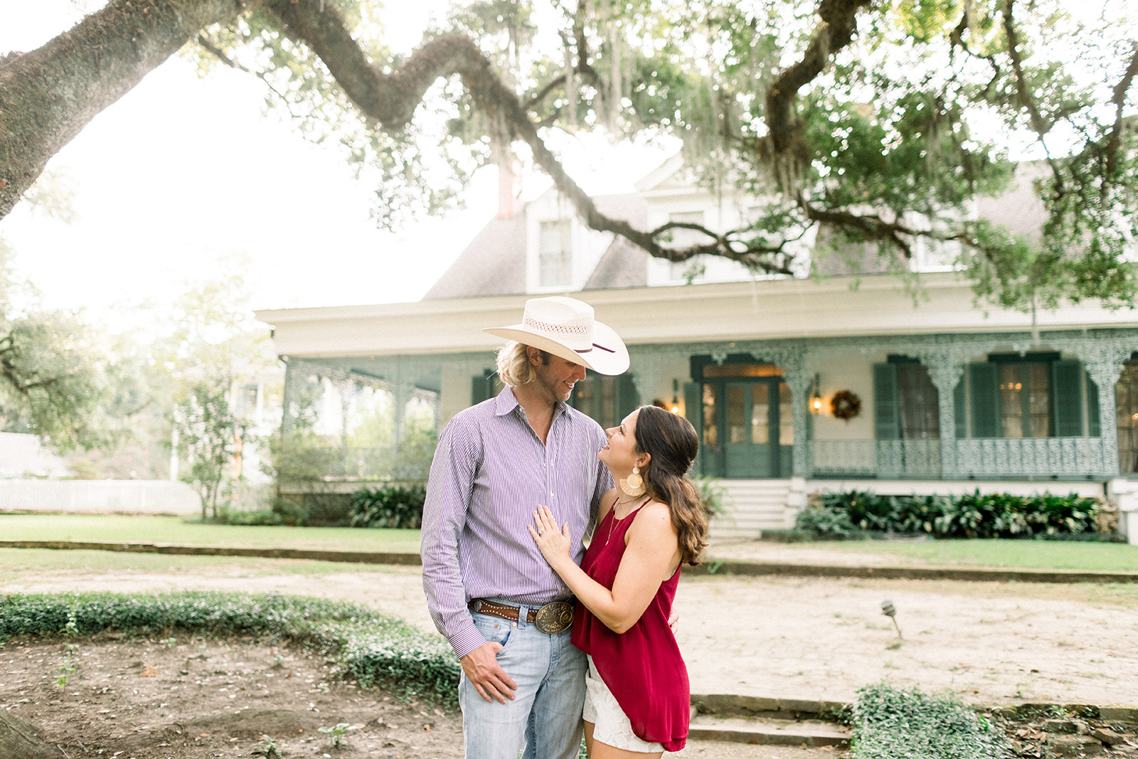 Chelsea Richard and her fiance Wesley pose for engagement photos at The Myrtles in St. Francisville, Louisiana. Photo by Sarah Alleman Photography.