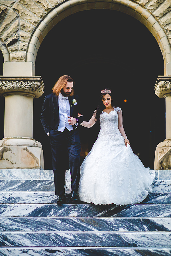 After the ceremony, the couple posed for photos with their bridal party at the W.P. Brown Mansion on St. Charles Avenue. The 22,000 square foot Romanesque Revival home was built in the early 1900s and is filled with ornate architectural details and opulent antiques, including the footboard of a bed that is believed to have been owned by Marie Antoinette.