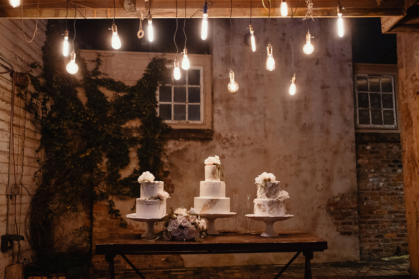 Frosted Fantasies by Nikki created three cakes that each mimicked the architectural details of the venue, such as the plaster on the wall behind the cake table.