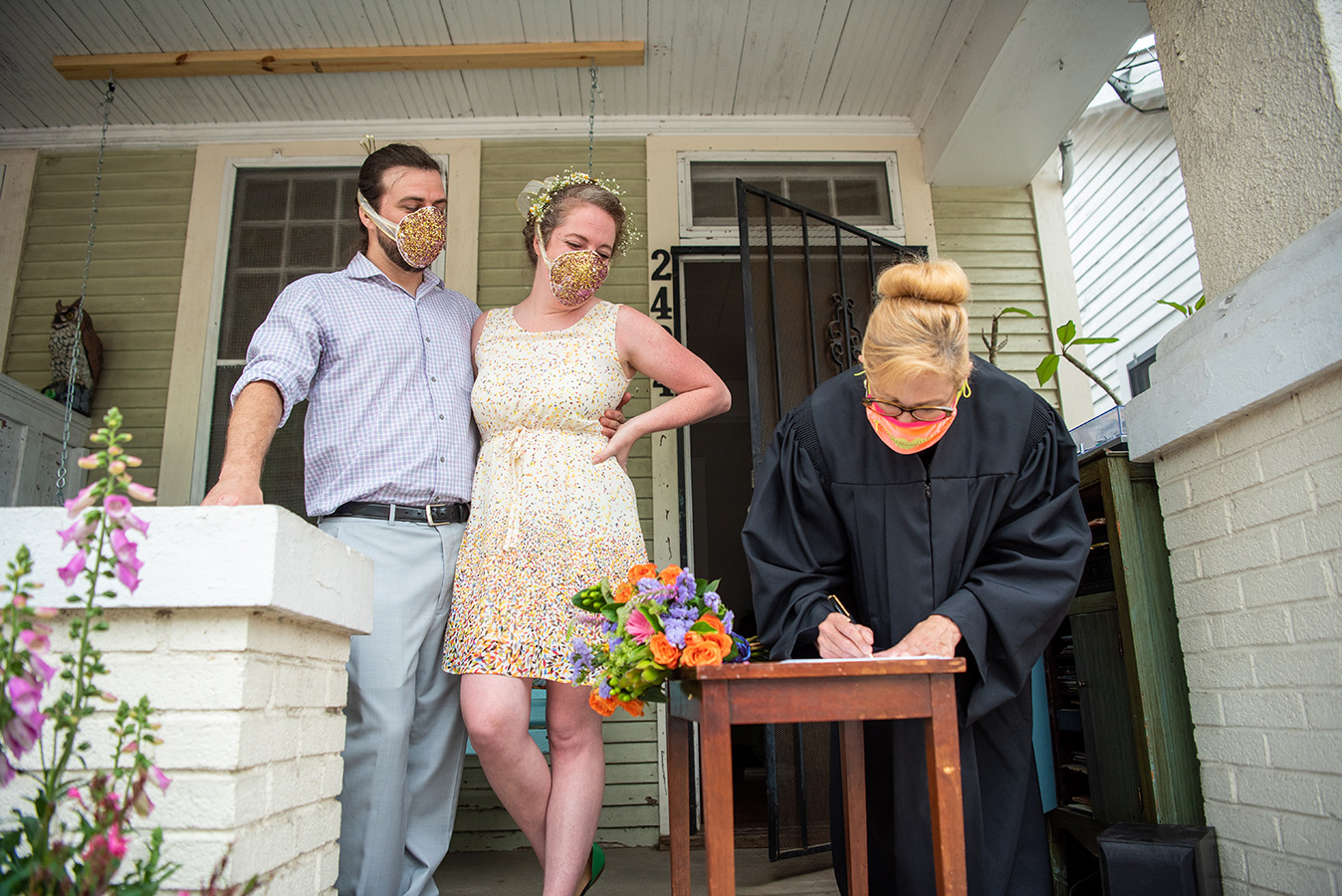 Elizabeth's biological mother dropped off a wedding present for the couple on their porch prior to the wedding: "two fully functional n-95 masks covered in glitter, courtesy of my step-dad, that proceeded to shed glitter everywhere like magic pixie dust through the entire ceremony," shares Elizabeth.