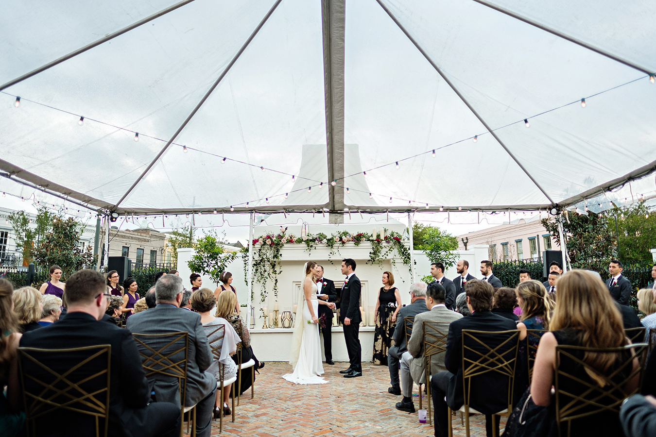 The wedding ceremony took place in Il Mercato's courtyard under a clear tent.