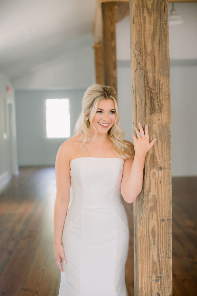 Bride wearing strapless bridal gown from I Do Bridal Couture. Photo: Emily Songer Photography