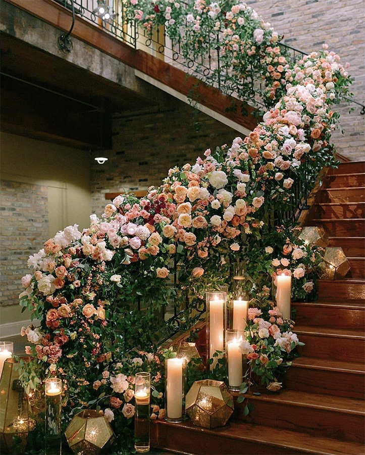 The Chicory's staircase decorated with flowers and candles. Photo: Greer Gattuso