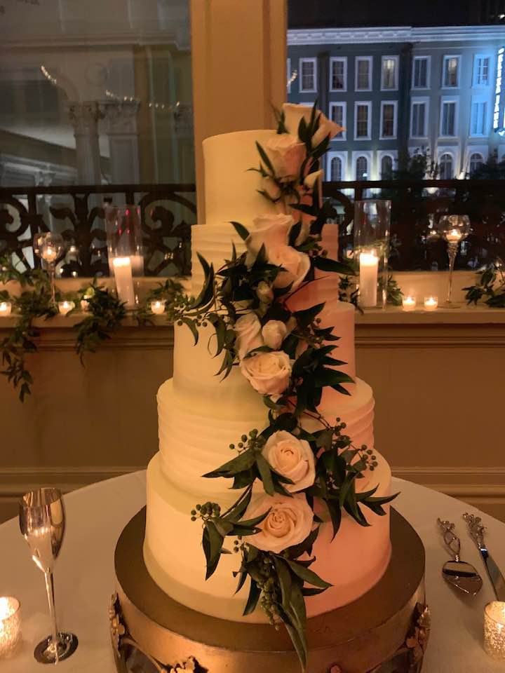 Wedding cake with fresh flowers by Beth's Flowers