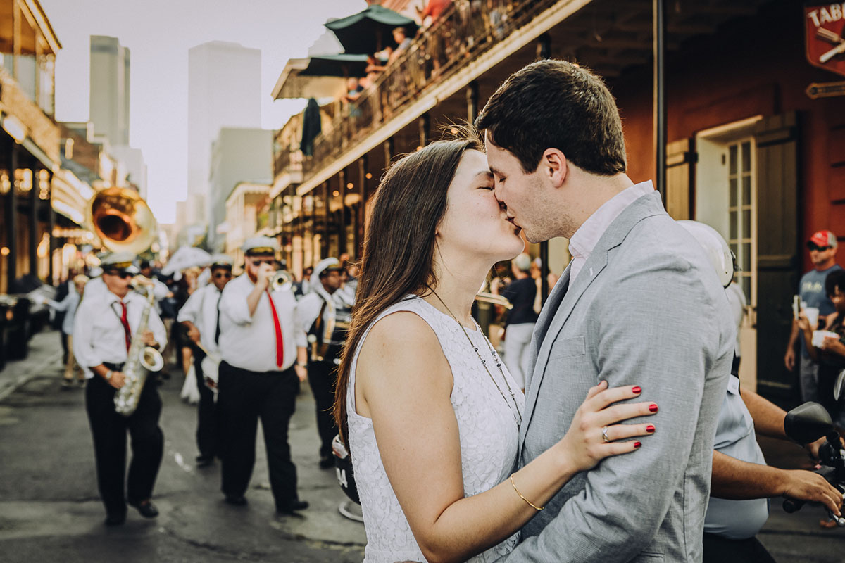 A bride and groom kiss during their Second Line on Bourbon Street. Photo: Capture Studio Photography