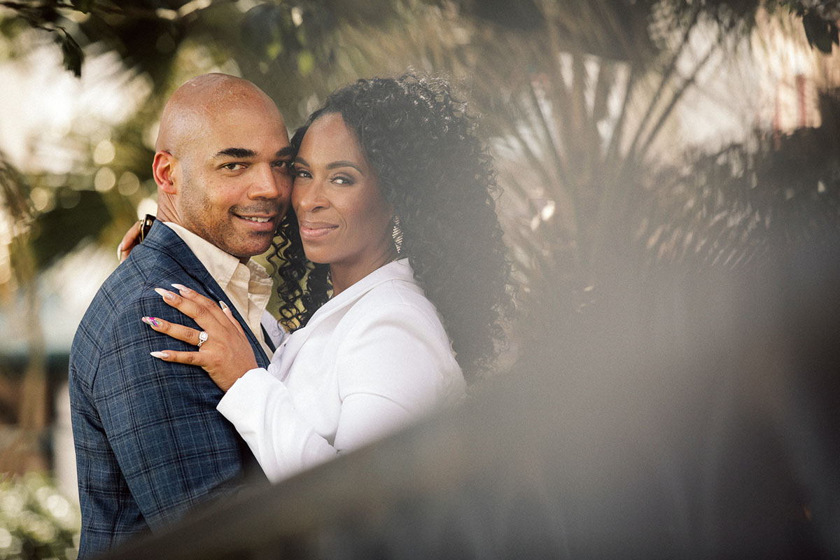 An engaged couple pose for engagement photos. Photo: Capture Studio Photography