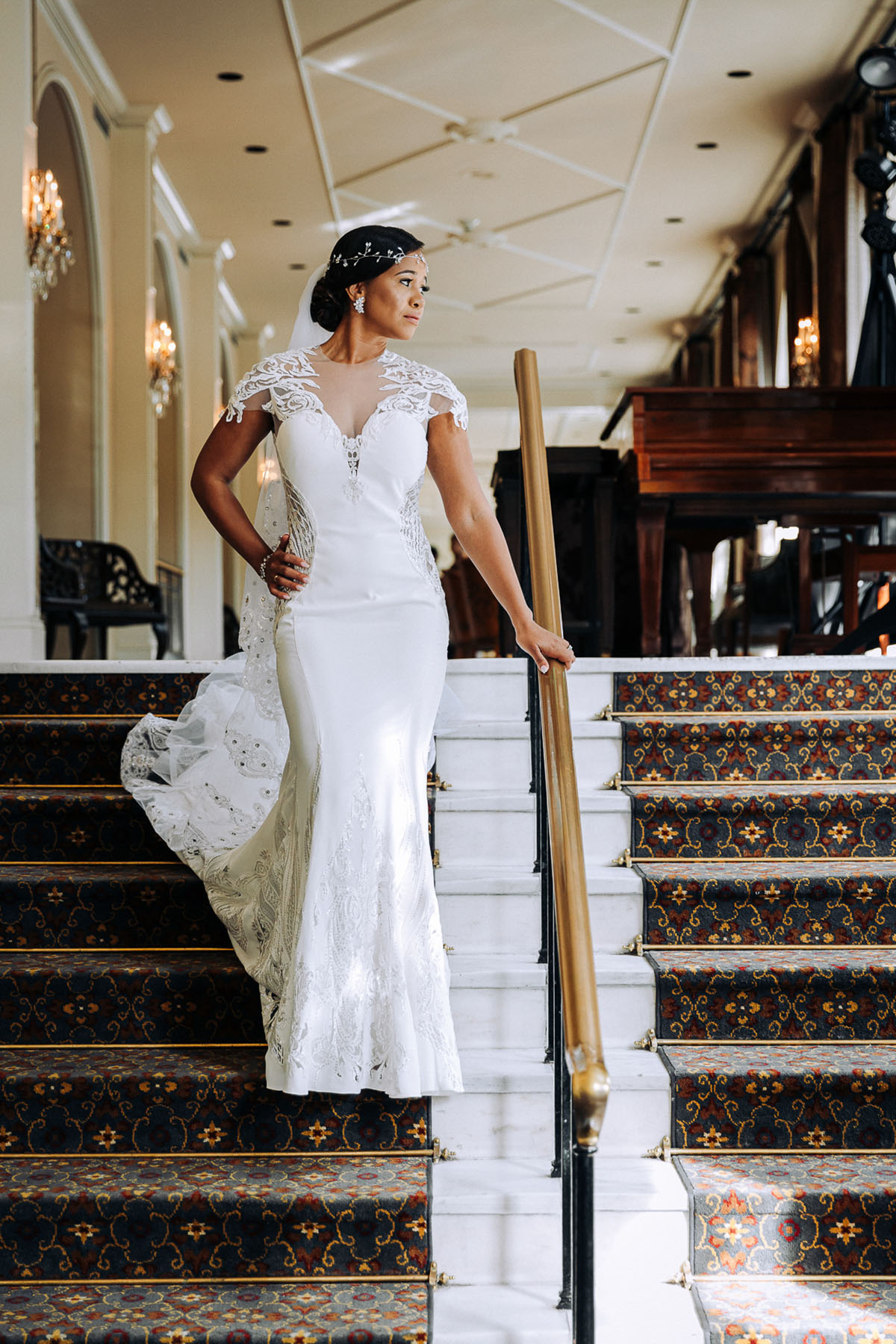 A bride poses for a photo in the lobby of the Omni Royal Orleans Hotel. Photo: Capture Studio Photography