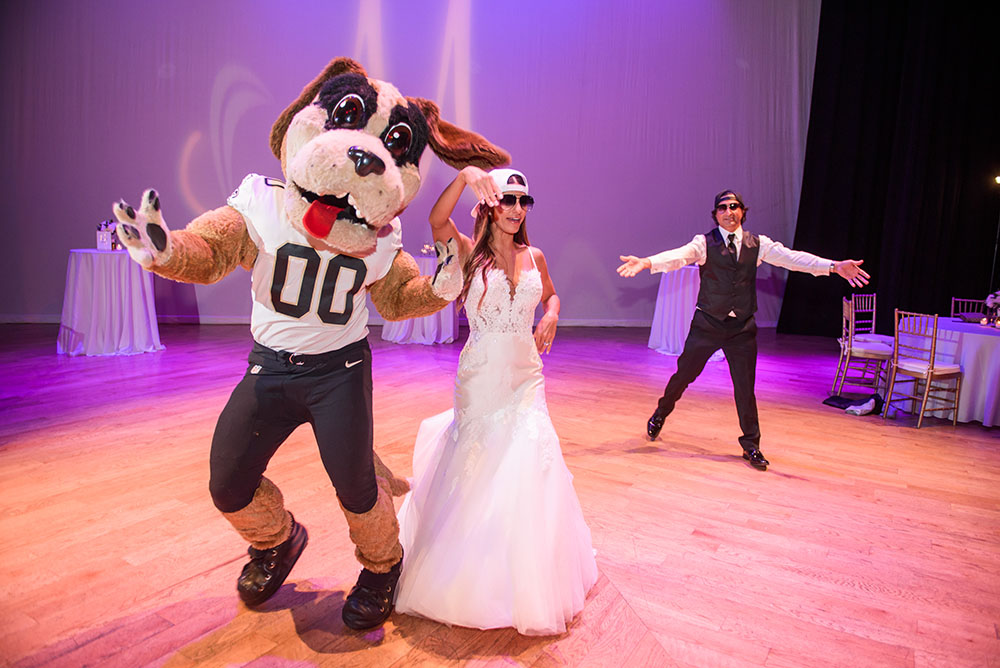 bride dancing with Saint's mascot