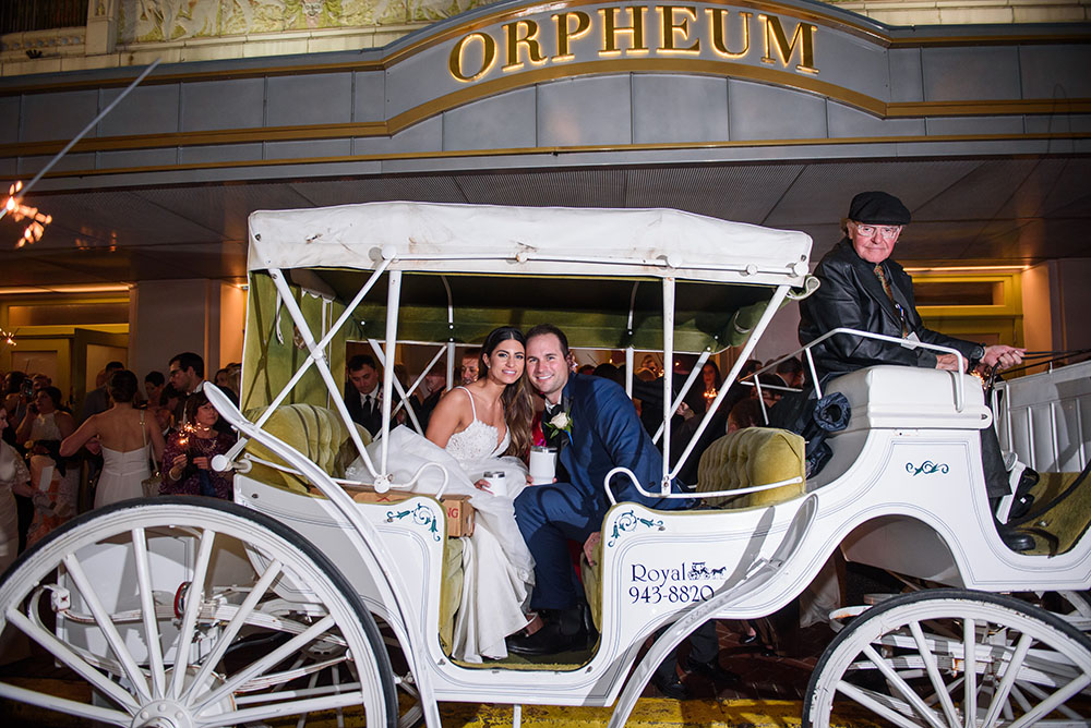 bride and groom in carriage outside the orpheum