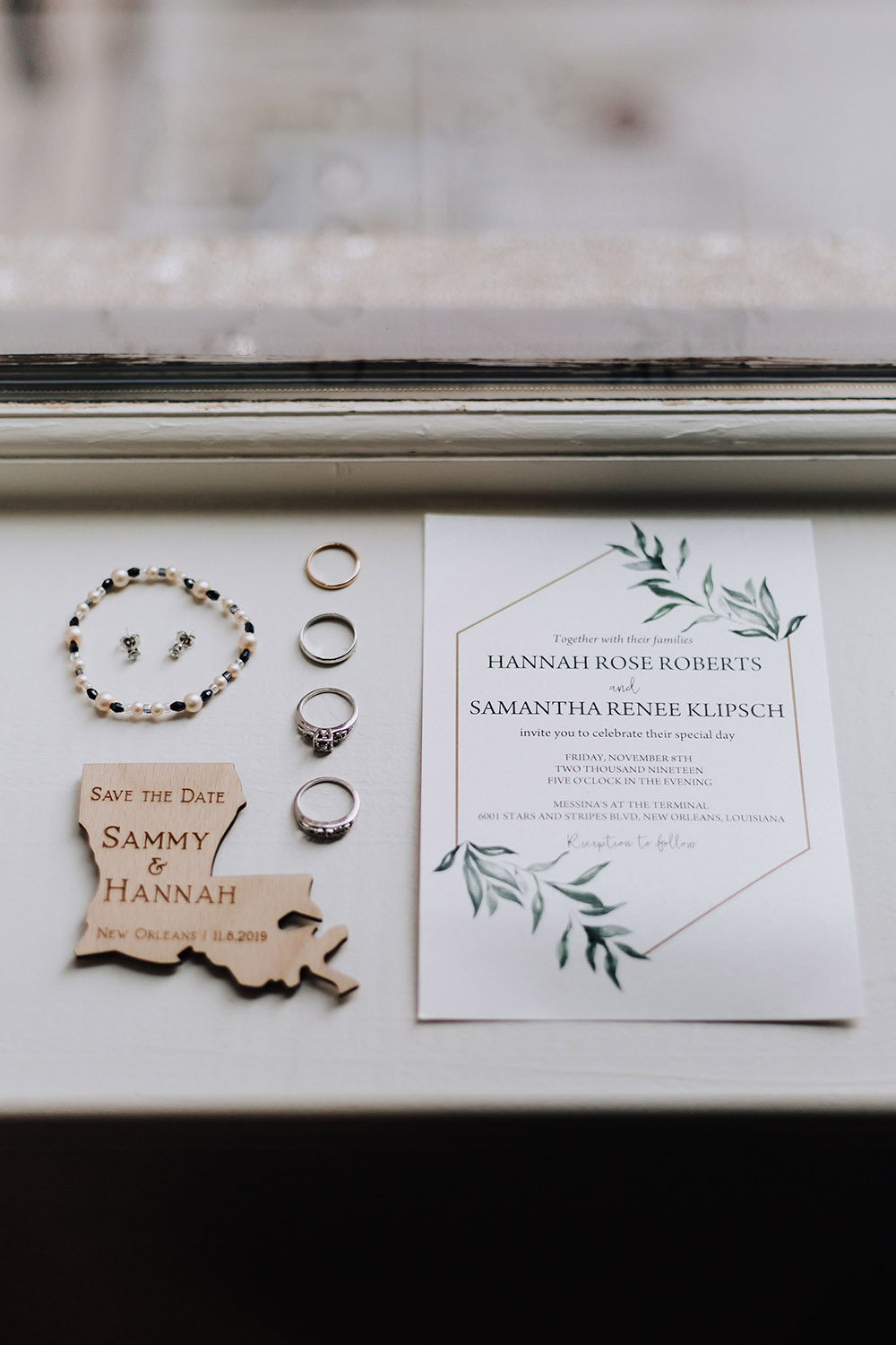bridal details wedding rings and invitations