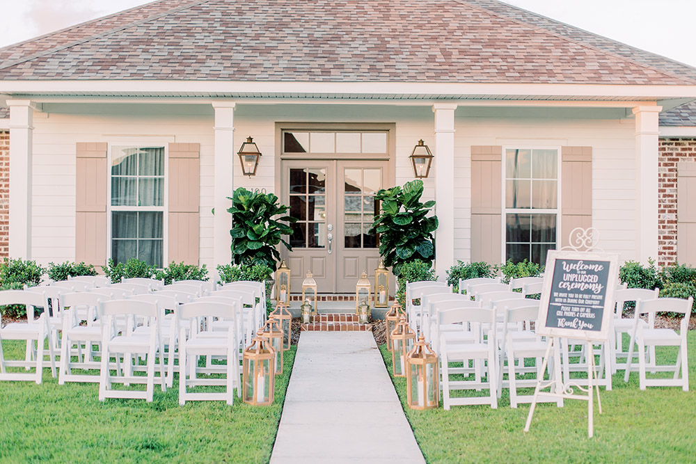 A wedding ceremony set up on the front lawn of a private home. Photo: Ashley Kristen Photography