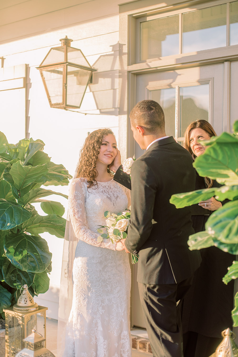 A bride and groom exchange vows during a front porch wedding ceremony. Photo: Ashley Kristen Photography