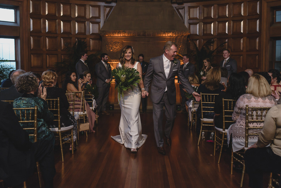 Newlyweds walk down the aisle for their wedding ceremony recessional. Photo: The Swansons