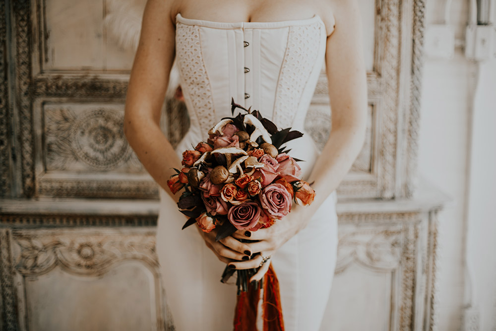 Bride's bouquet with pink and orange roses and mushrooms mixed throughout!