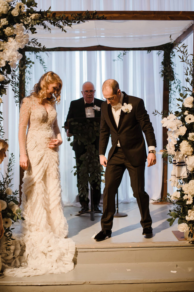 Ross breaks the glass.