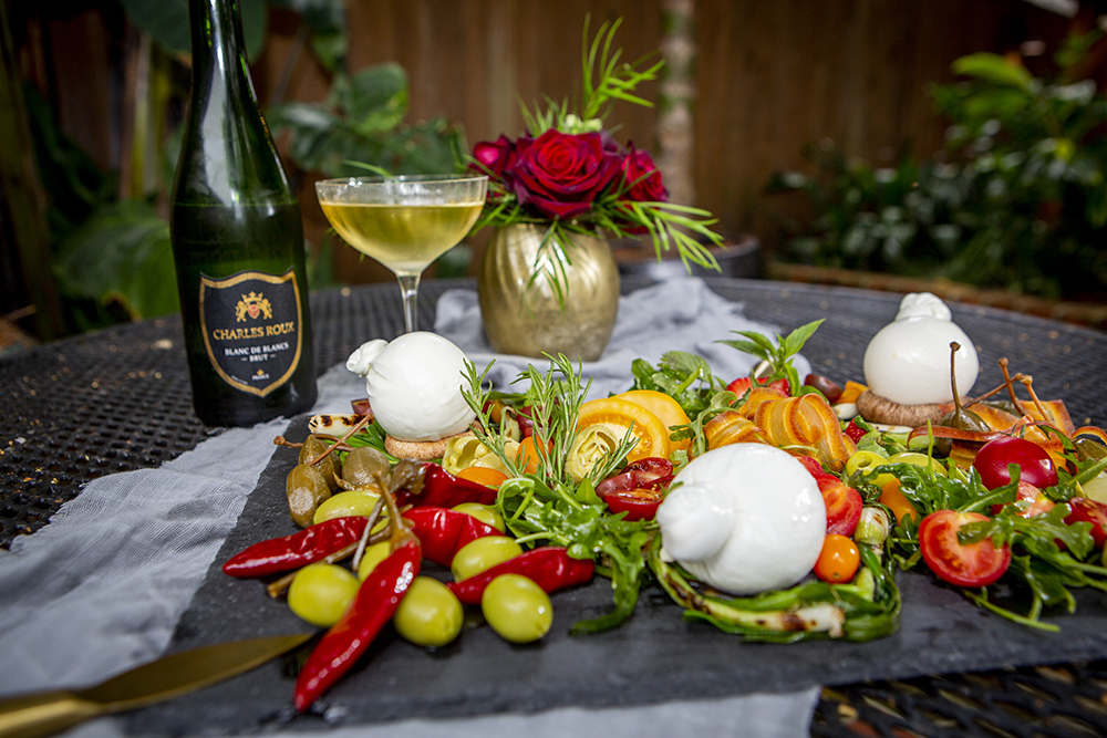 Burrata with an assortment of toppings and ciabatta croutons, served with Champagne
