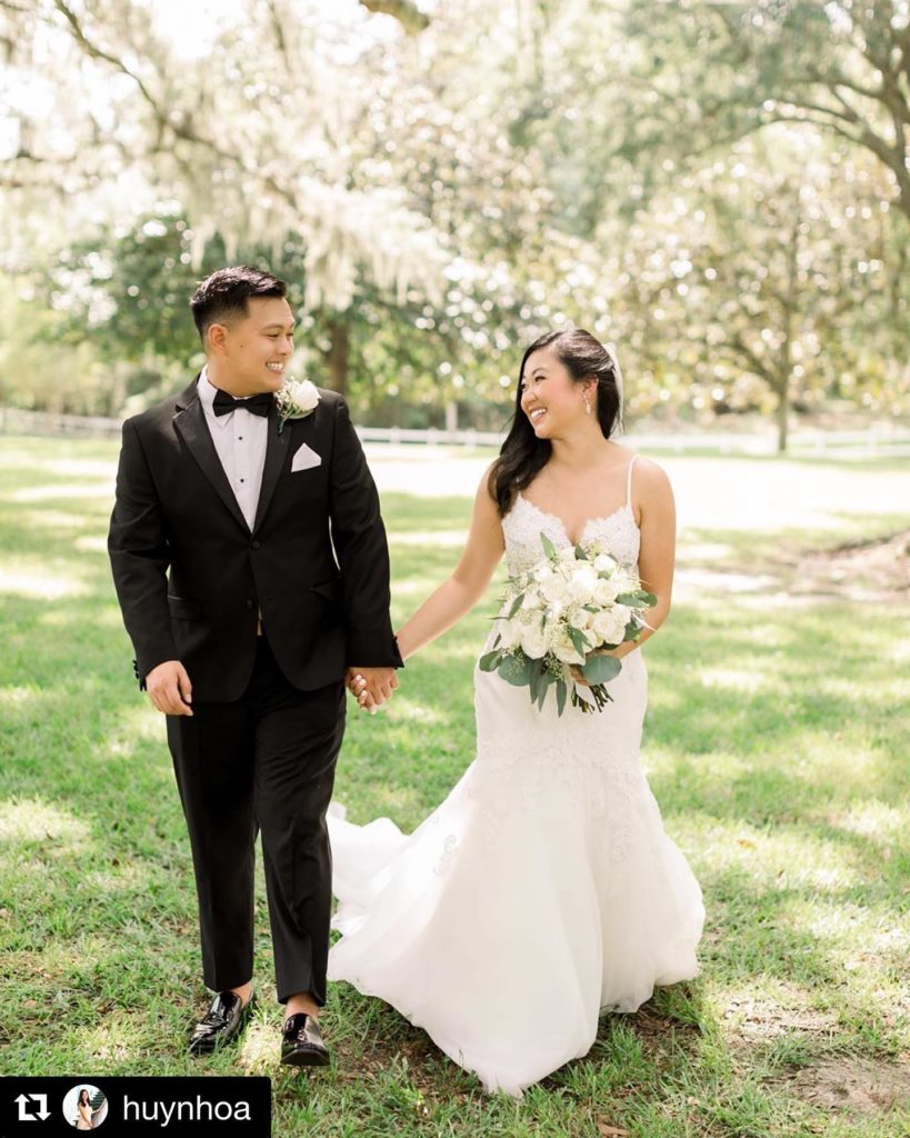 Bride with Groom in classic black tuxedo from Tuxedos to Geaux