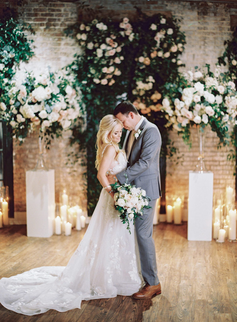 Bride and groom kiss at The Chicory in New Orleans by Peony Photography