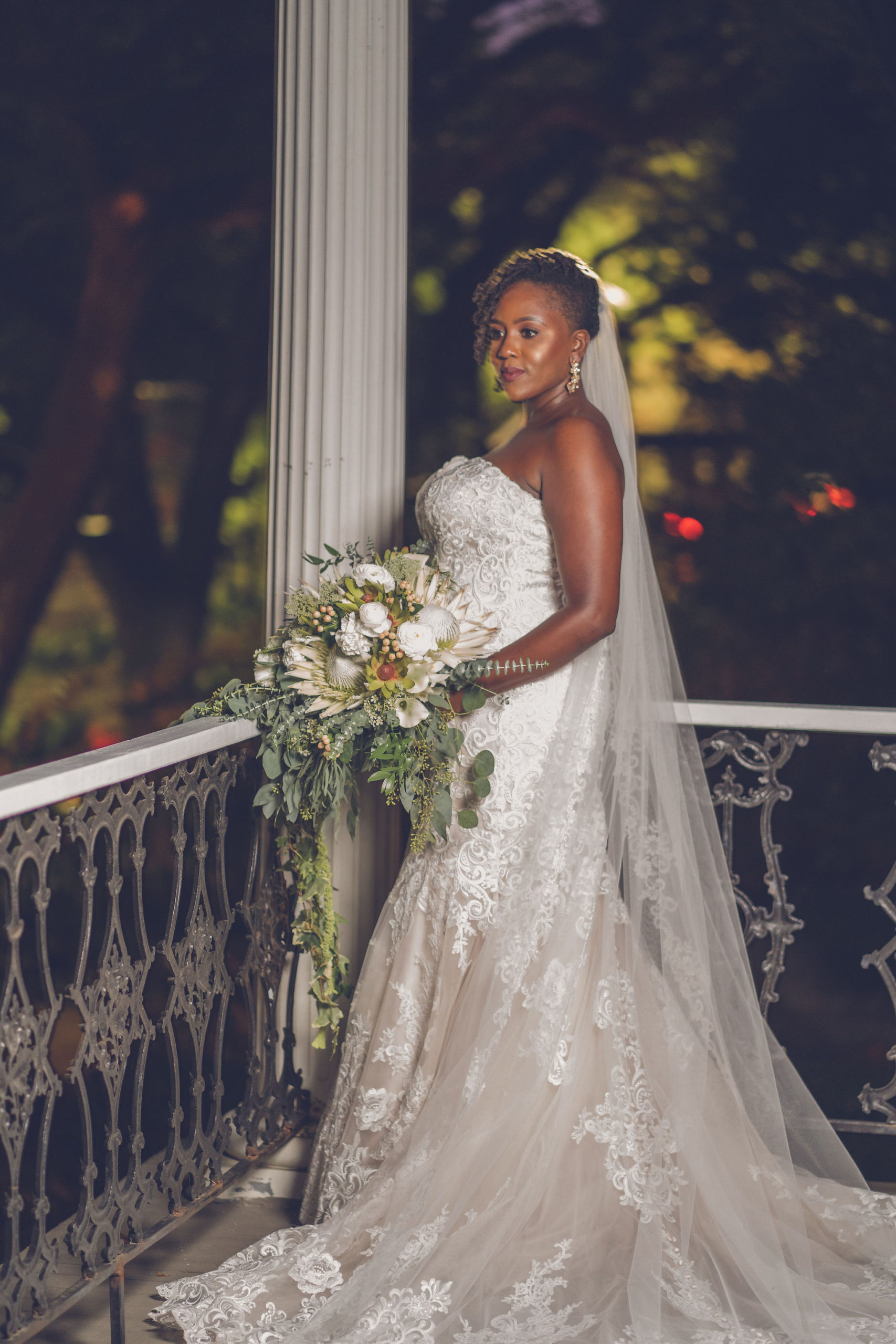 Bride on New Orleans balcony XXI Facets Photography
