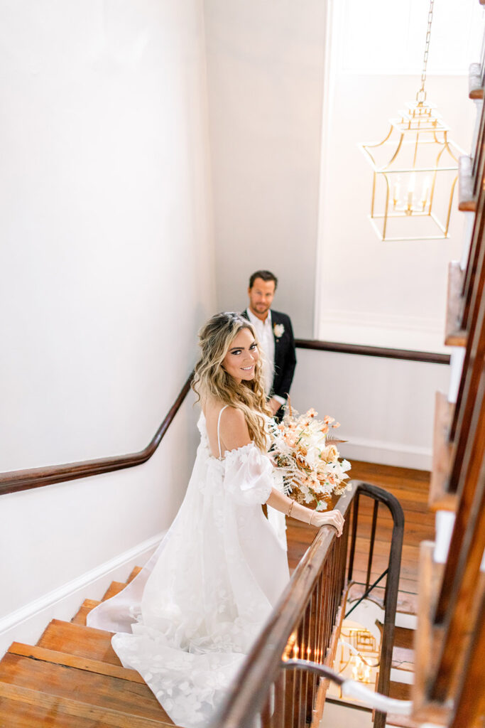 bride and groom on a staircase