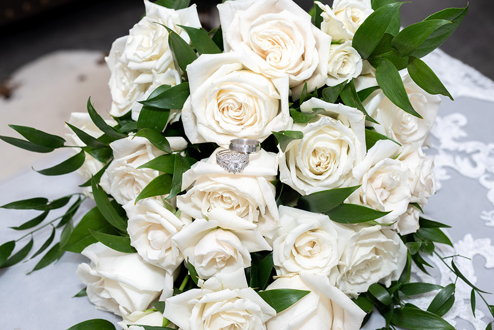 wedding rings in rose bouquet