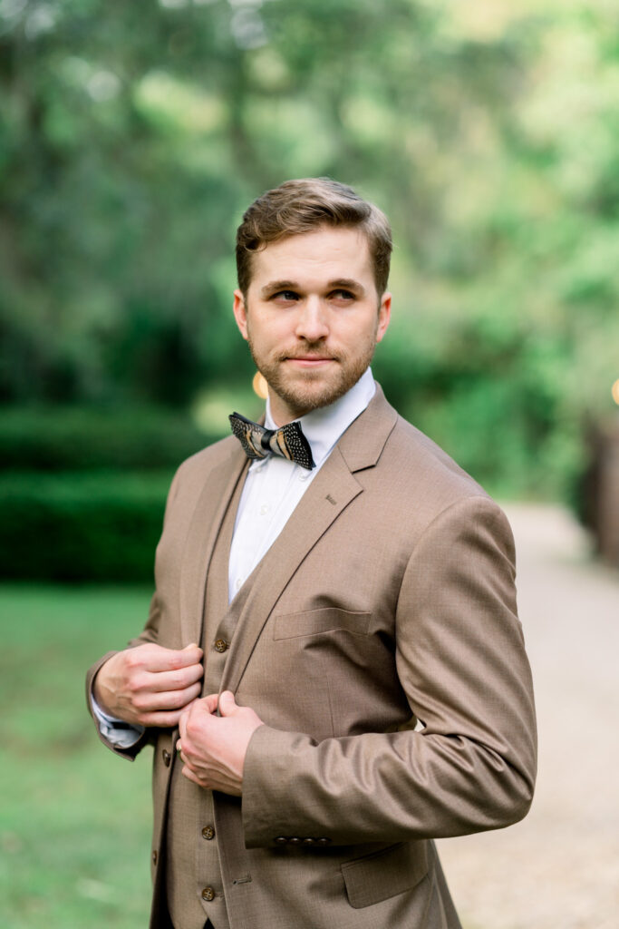 groom in brown suit from Tuxedos to Geaux