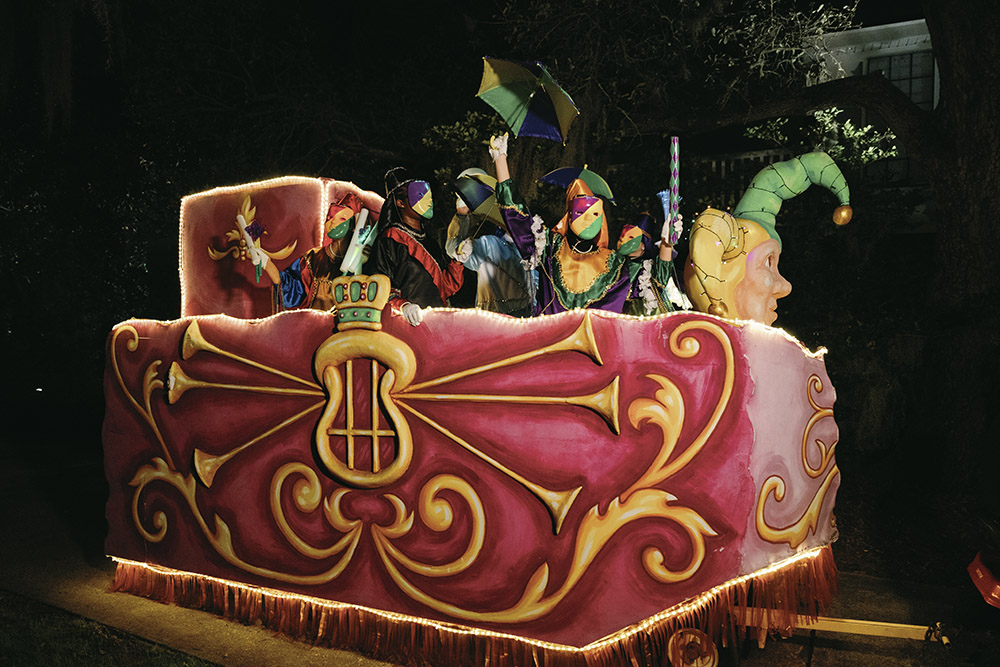 Mardi Gras–style parade float with masked riders celebrating during a New Orleans wedding second line.