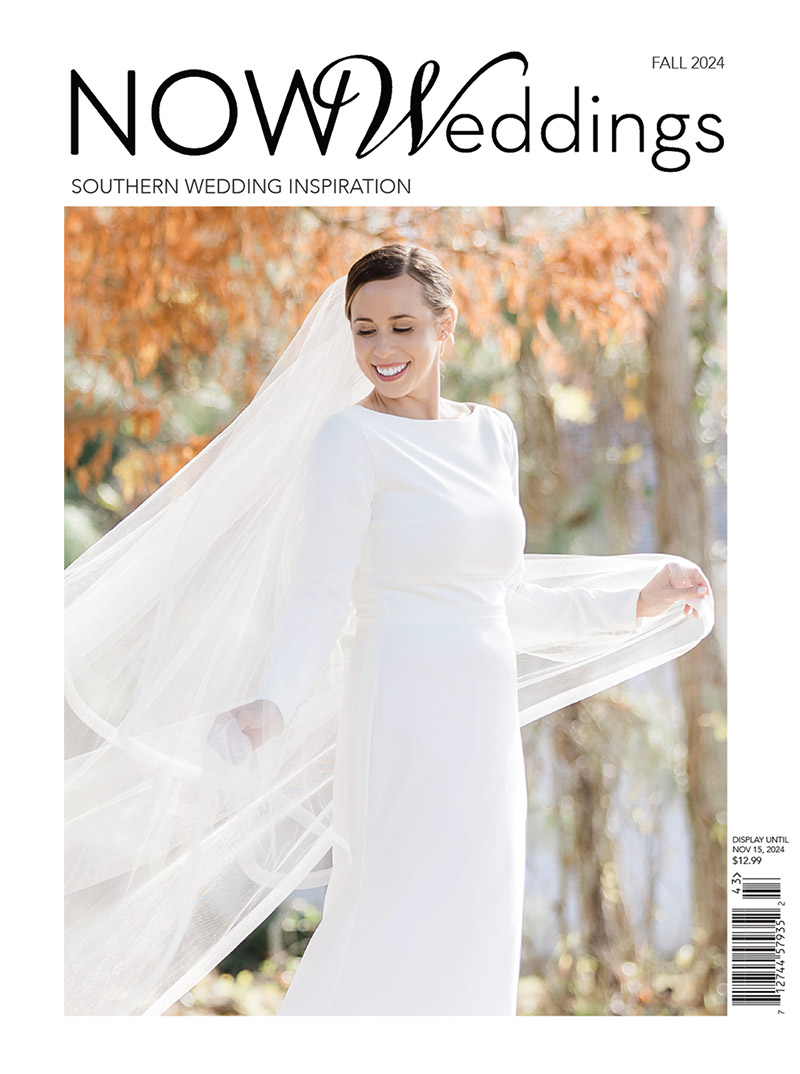 A bride in a long-sleeved white gown and veil smiles, standing outdoors with autumn leaves in the background. The cover text reads, NOW Weddings Magazine: Southern Wedding Inspiration, Fall 2024.