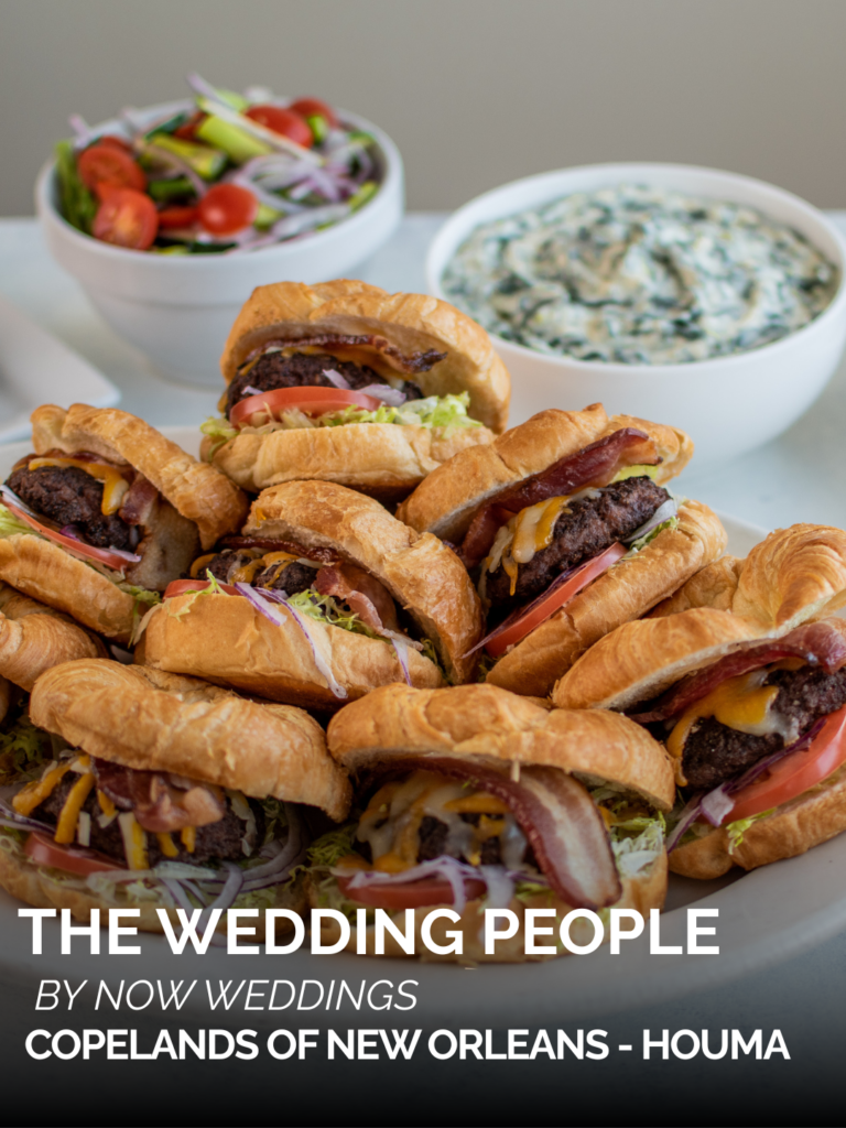 Croissant sandwiches with lettuce, tomato, cheese, and beef patties beside salad and dip; Copeland’s Houma Catering The Wedding People spotlight