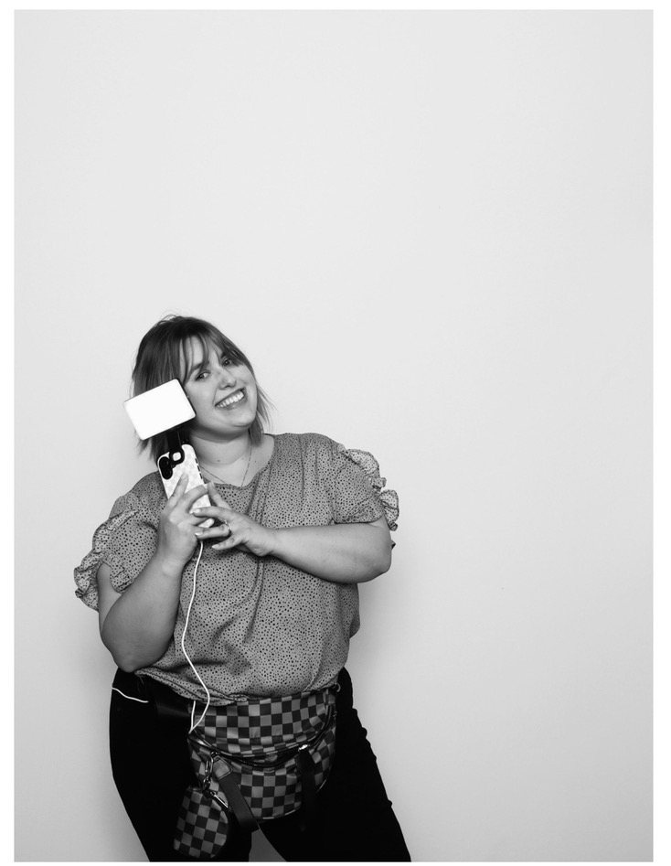 Anna Borne Becnel of Memories in Motion poses for a photo with her phone.