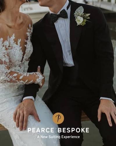 Bride in a white lace gown and groom in a tuxedo, featuring Pearce Bespoke high-end content creation branding.