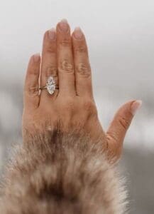 Marquise-cut diamond engagement ring on a woman’s hand.