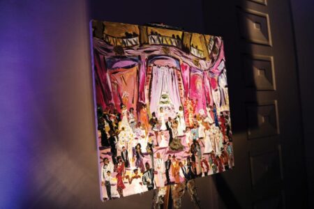 Colorful painting on easel of a formal ballroom scene, with a pink and purple backdrop and dramatic lighting.