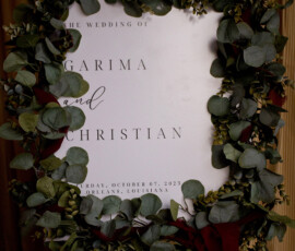 Wedding welcome sign with green foliage: The wedding of Garima and Christian, October 07, 2023, Orleans, Louisiana.