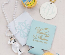 Gulf South wedding favors: Moon Pies, cake topper, New Orleans beads, and custom koozies with Victoria & Andrew’s date.