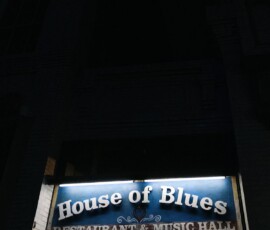 House of Blues Restaurant & Music Hall sign glows dimly, marking the venue entrance—ideal for a New Orleans wedding.